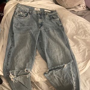 knee ripped wide leg blue jeans